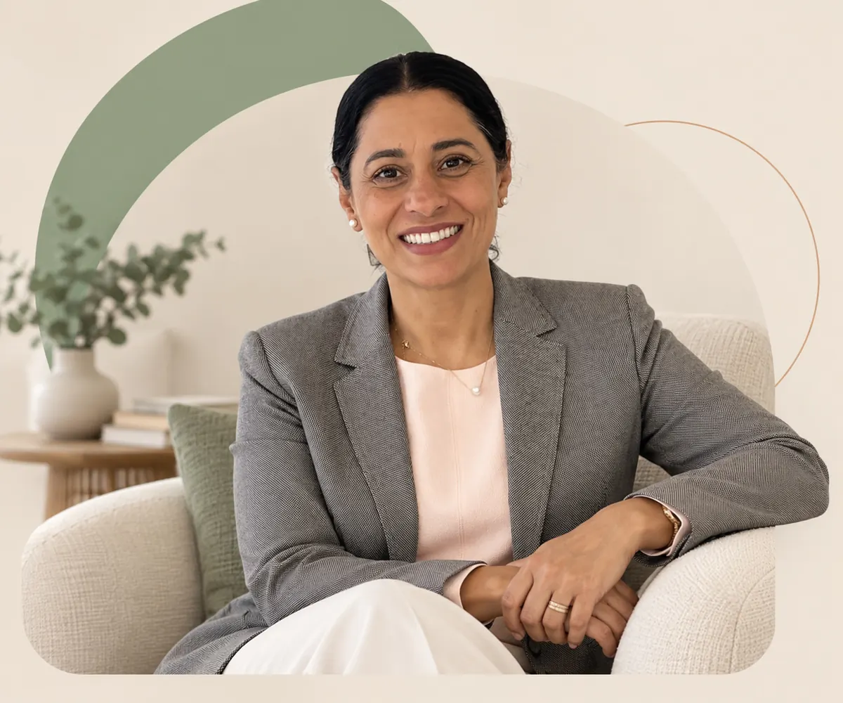 Mandeep Virk, MA, RCC, seated in a softly lit counselling room in Vancouver